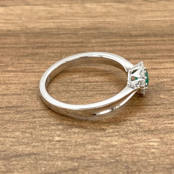 Emerald and diamond halo ring.