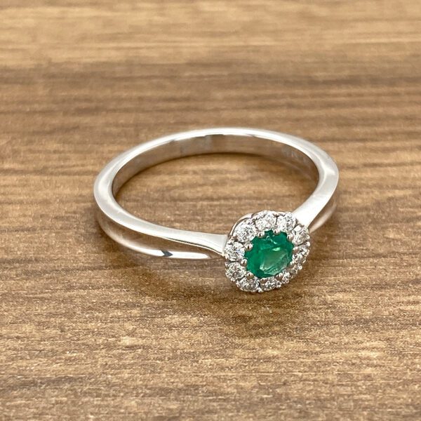 Emerald and diamond halo ring.