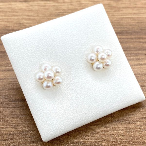 Pearl flower stud earrings on display.