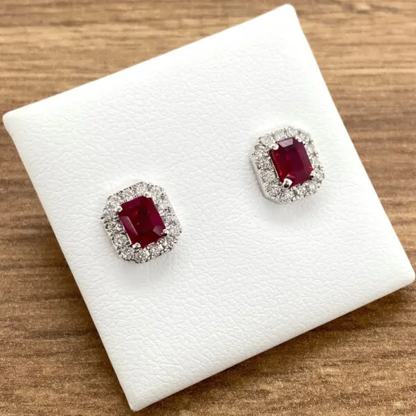 Ruby and diamond halo stud earrings.