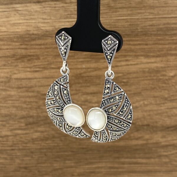 Silver marcasite and mother-of-pearl earrings.