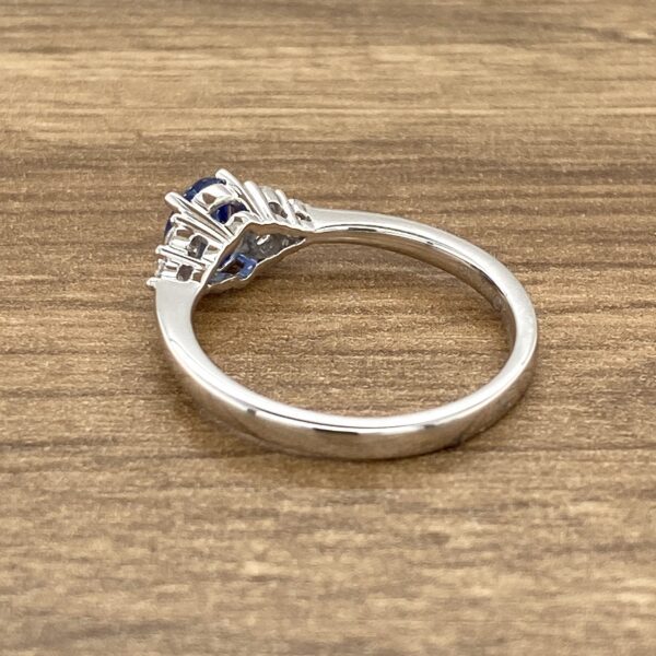 Here's an alt tag for the image: White gold sapphire ring.