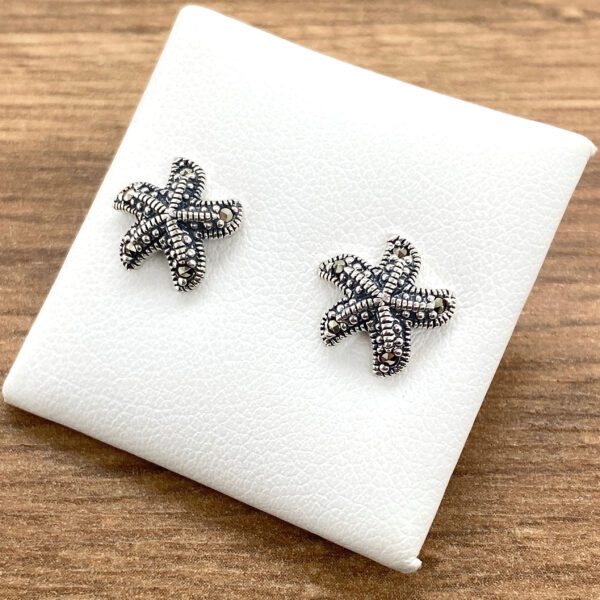 Silver starfish stud earrings.