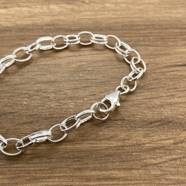 Silver chain bracelet, clasp close-up.