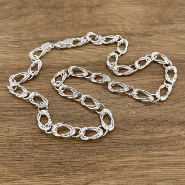 Silver chain necklace, twisted links.