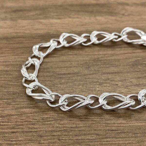 Silver chain bracelet, elegant design.