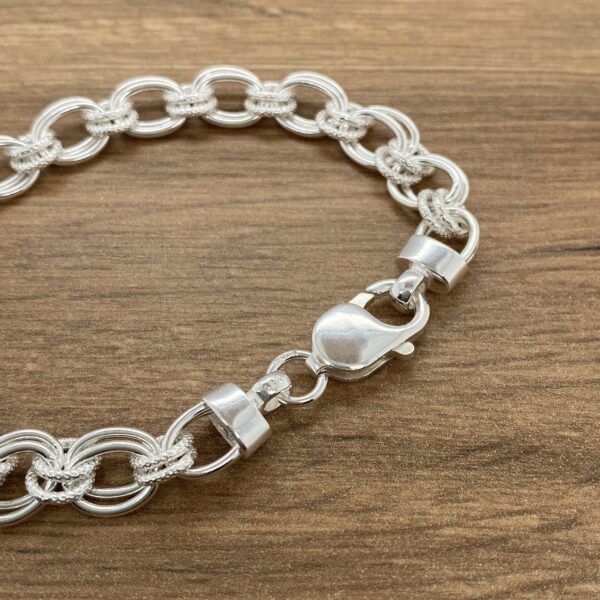 Silver bracelet with textured links.