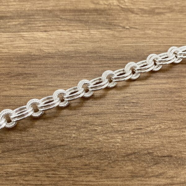 Silver textured chain bracelet.