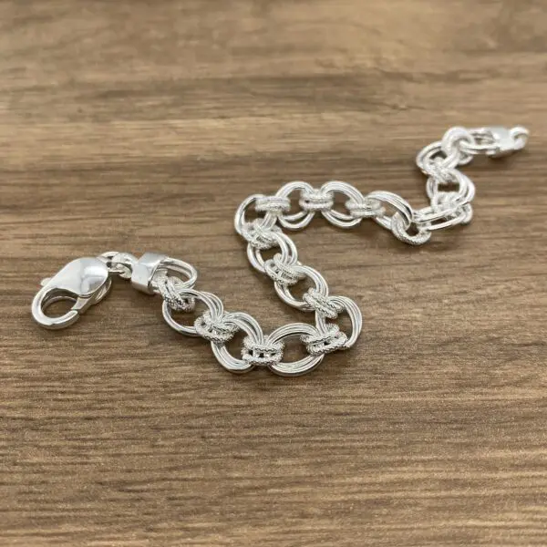 Silver chain link bracelet.