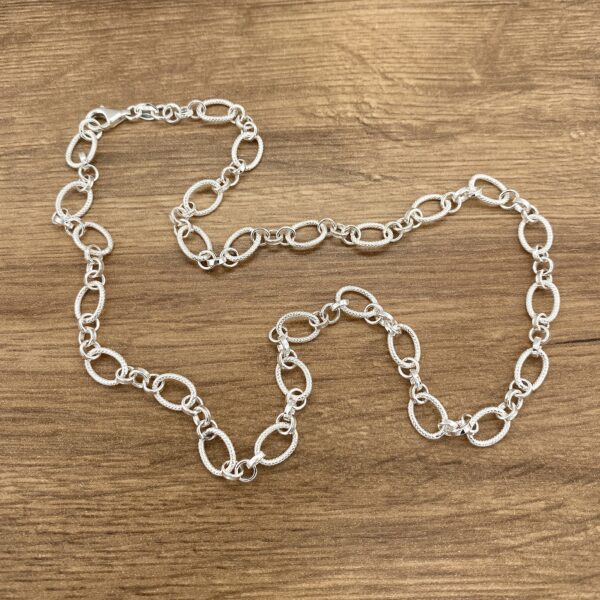 Silver oval link chain necklace.