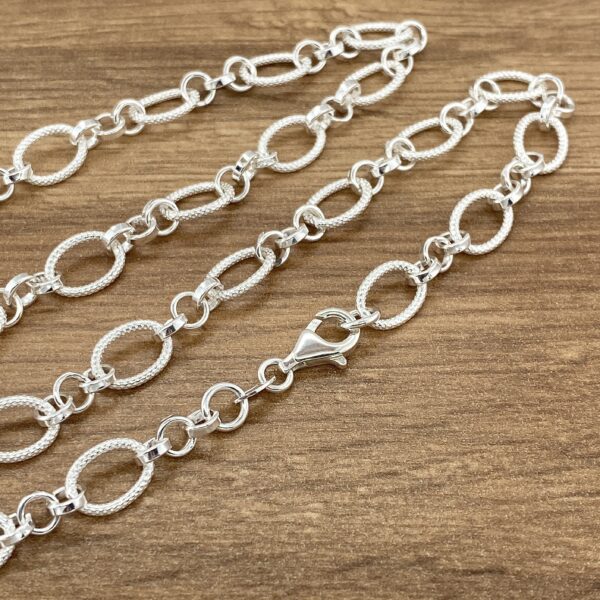 Silver oval link chain necklace.