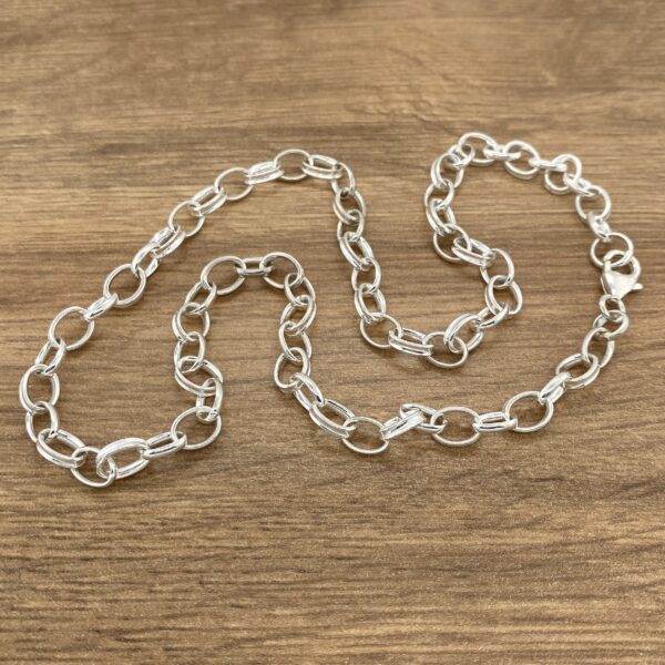 Silver oval link chain necklace.