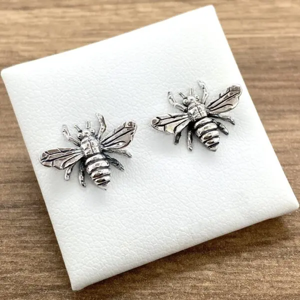 Silver bee stud earrings.