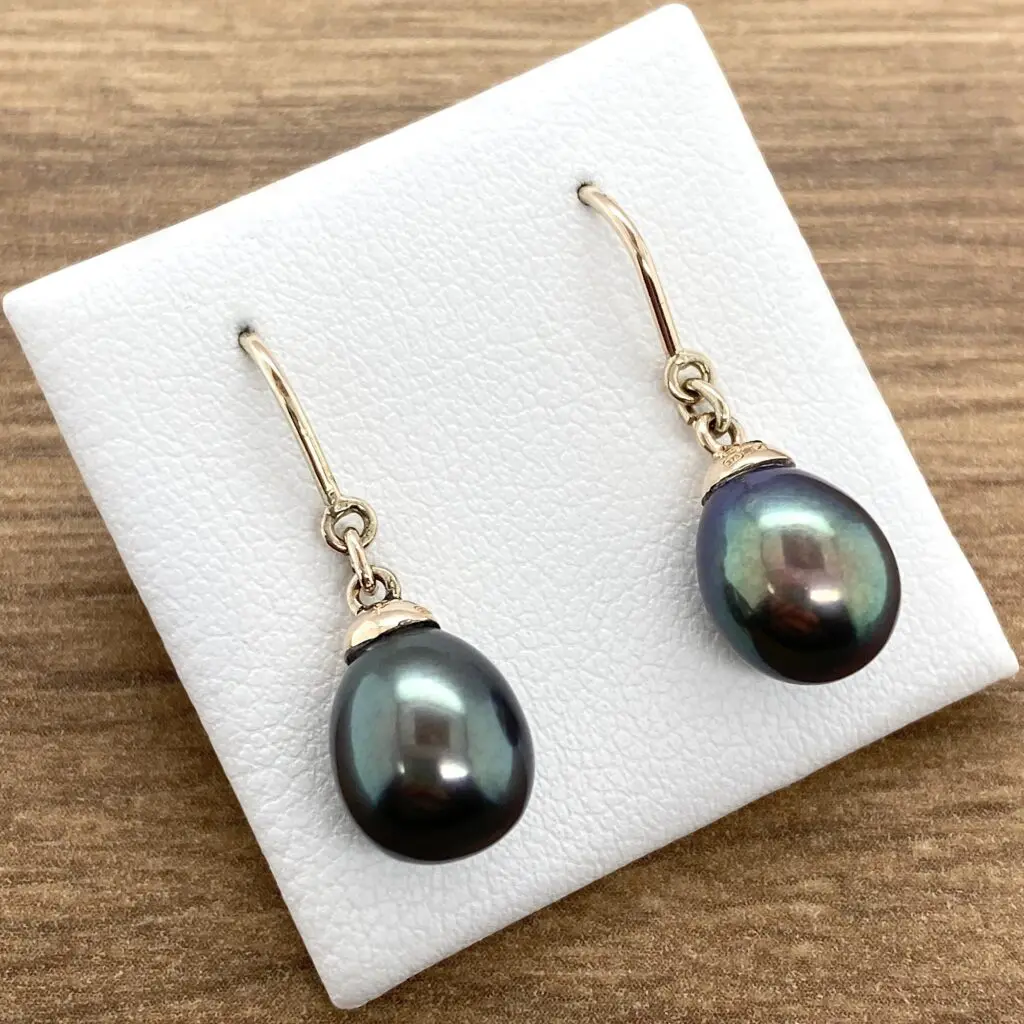 Dark pearl drop earrings, gold hooks.