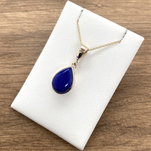 Gold teardrop lapis lazuli pendant necklace.