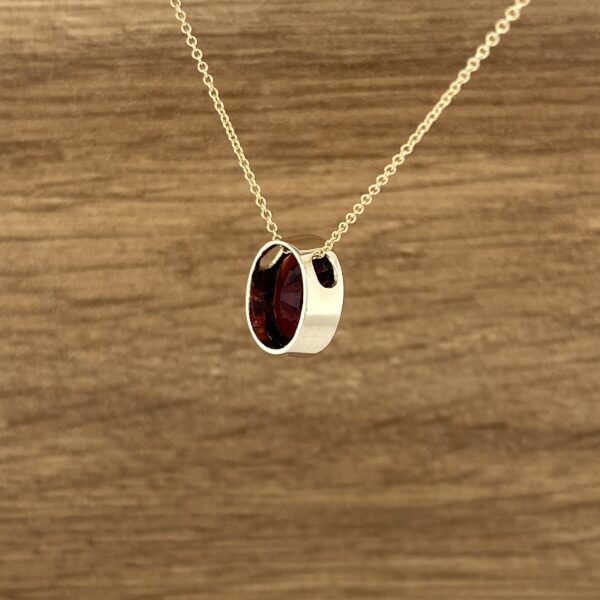 Garnet pendant necklace, gold chain.